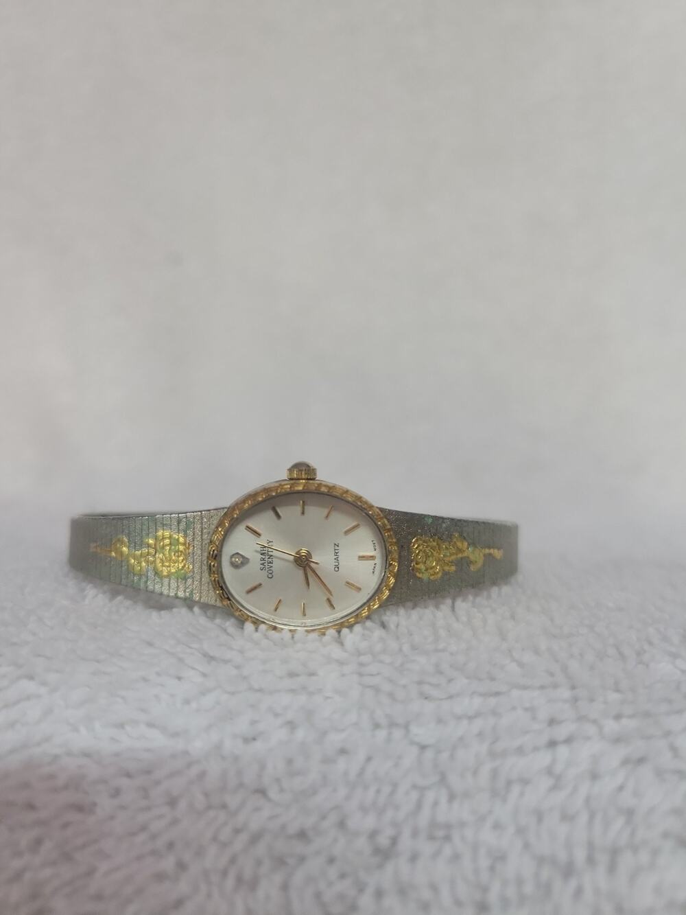 Vintage Sarah Coventry ladies watch featuring a dainty silver-tone mesh bracelet